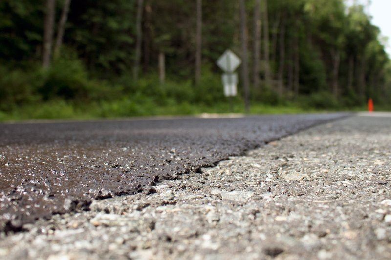 Close-up view of roadway with slurry seal treatment